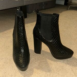 Black snakeskin heeled boots